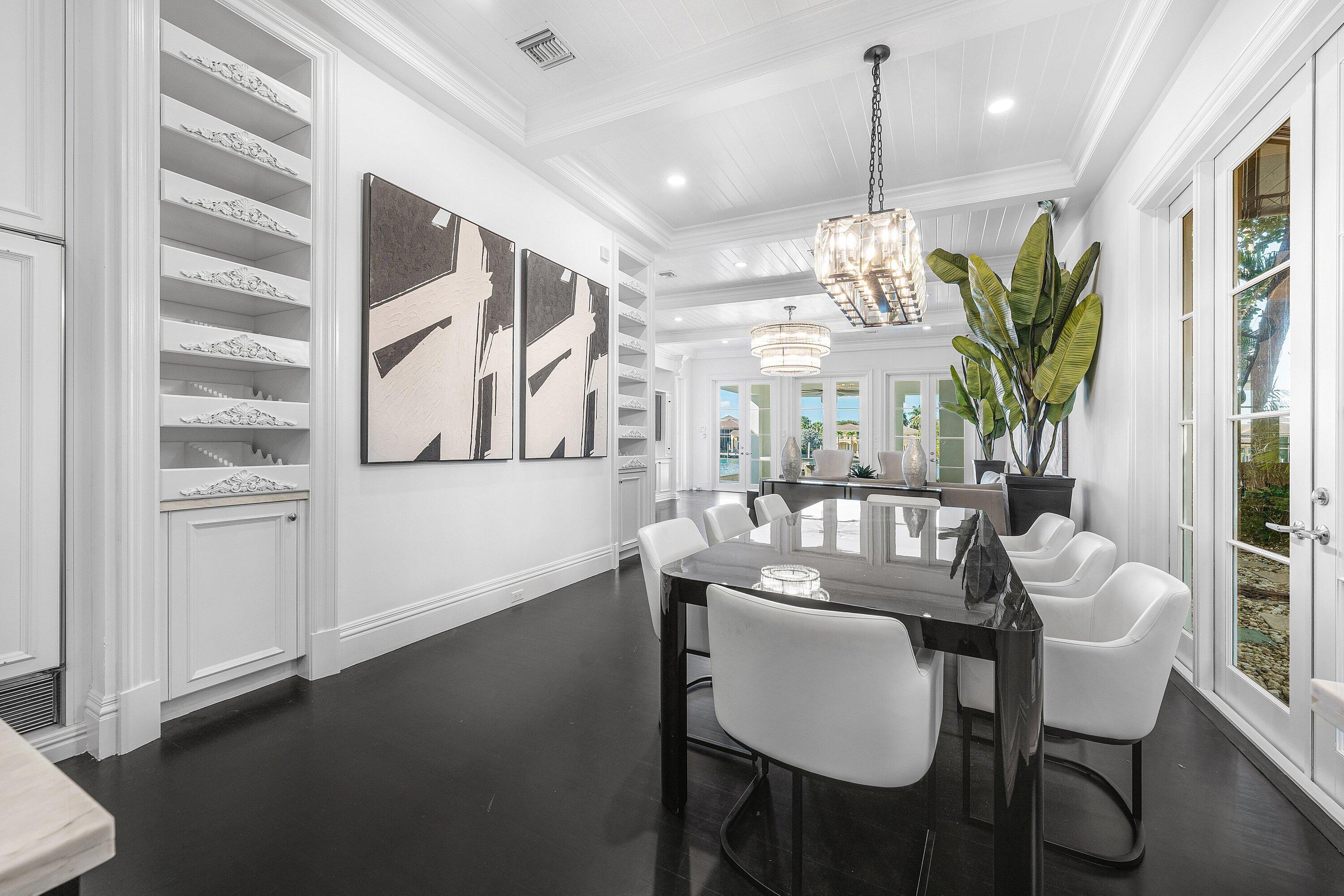 485 Northeast Spanish Trail Boca Raton, FL 33432 - Photo 25 of 76 a dining room with furniture and window