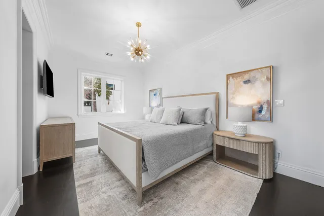 a living room with fireplace furniture and a large window