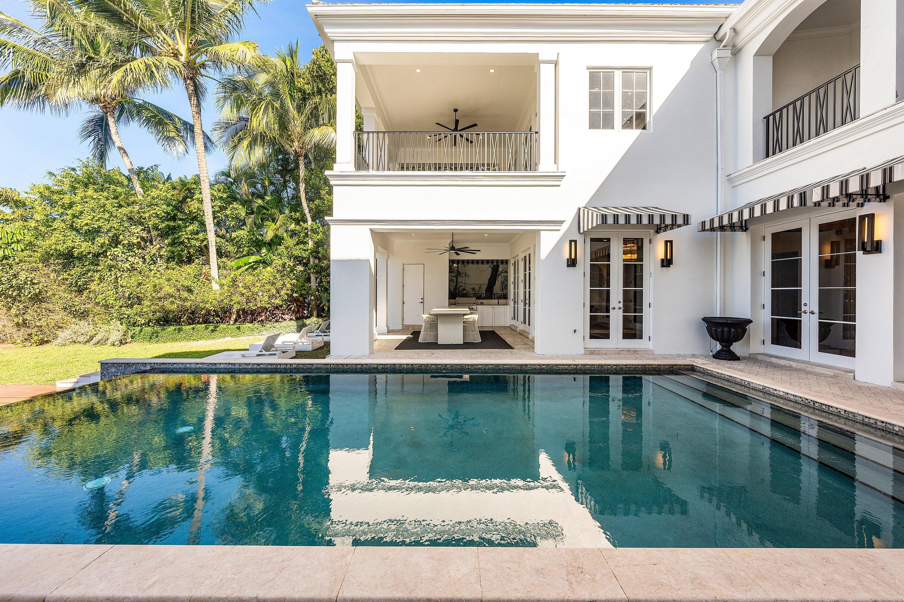 485 Northeast Spanish Trail Boca Raton, FL 33432 - Photo 31 of 76 a view of swimming pool with a outdoor seating