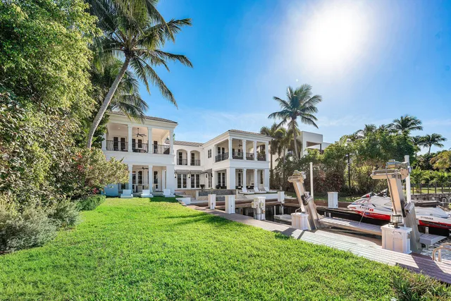 a bathroom with a sink mirror and window