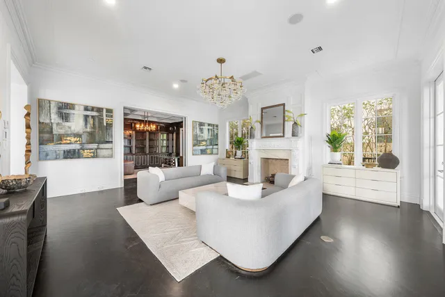 a spacious bathroom with a granite countertop toilet a sink and a mirror
