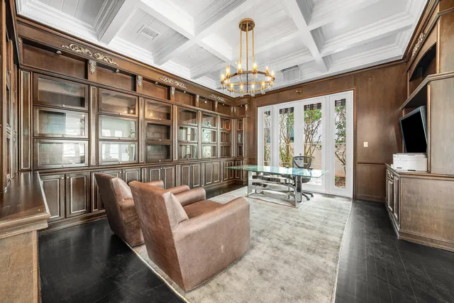 a bedroom with a bed and a flat tv screen on dresser