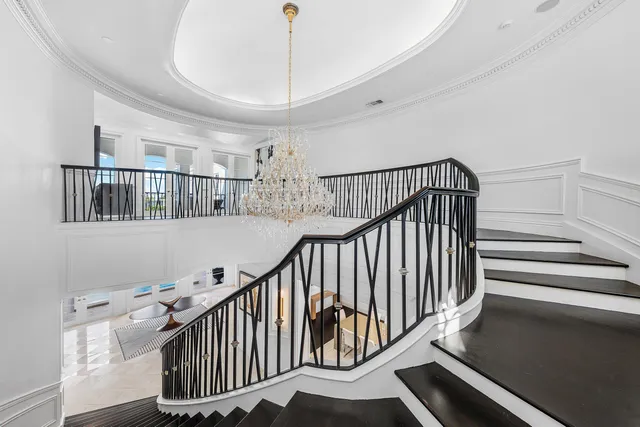 an aerial view of a house with a yard swimming pool a yard and outdoor seating