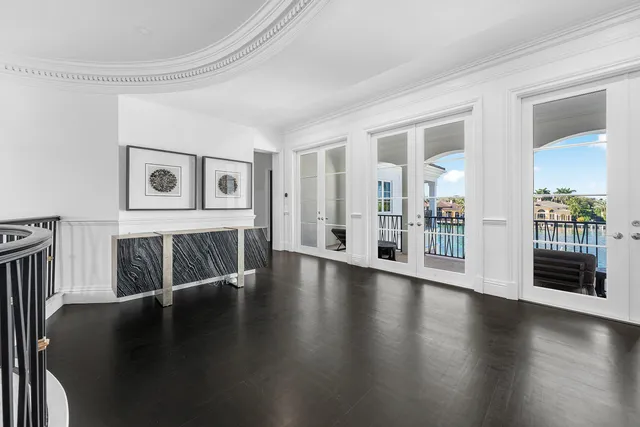 an aerial view of a city with lots of residential buildings lake and ocean view