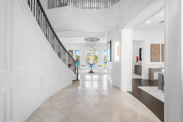 a view of a work space with wooden floor and windows