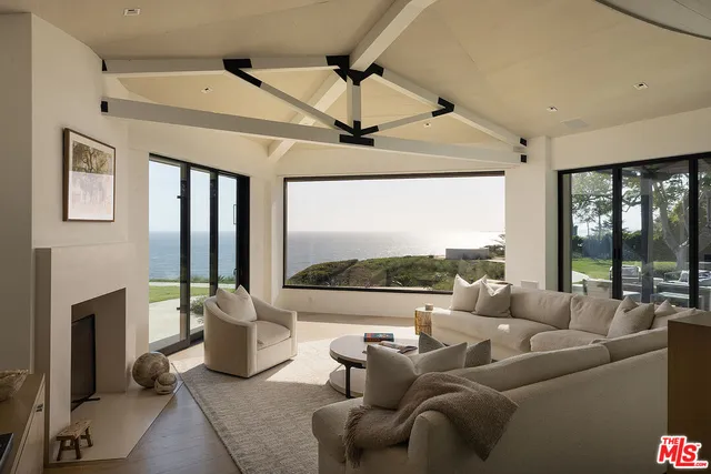 a kitchen with stainless steel appliances a sink a stove and a center island