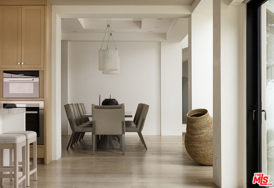 4145 Creciente Drive Santa Barbara, CA 93110 - Photo 16 of 57 a dining room with furniture and window