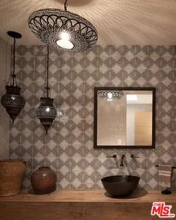 a living room with furniture and floor to ceiling windows