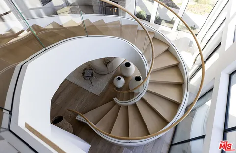 a bed room with a bed and a large window