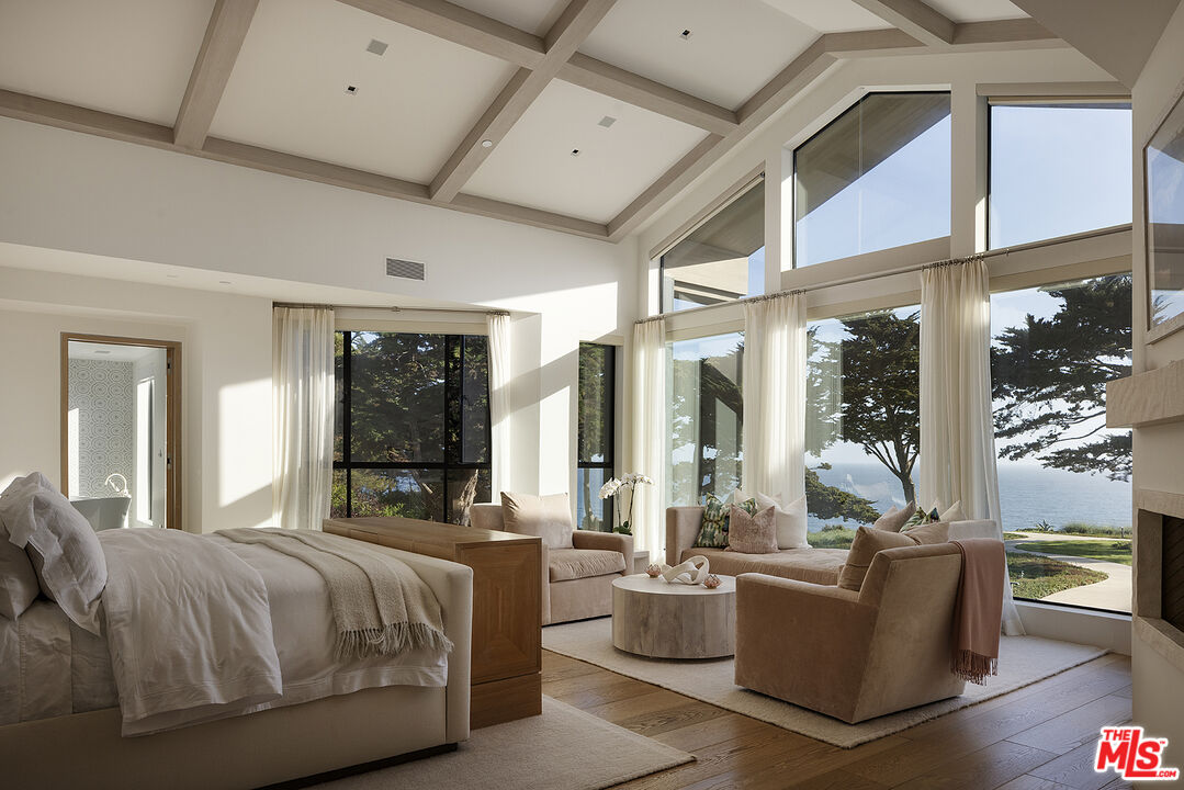 4145 Creciente Drive Santa Barbara, CA 93110 - Photo 23 of 57 a bed room with a bed and a large window