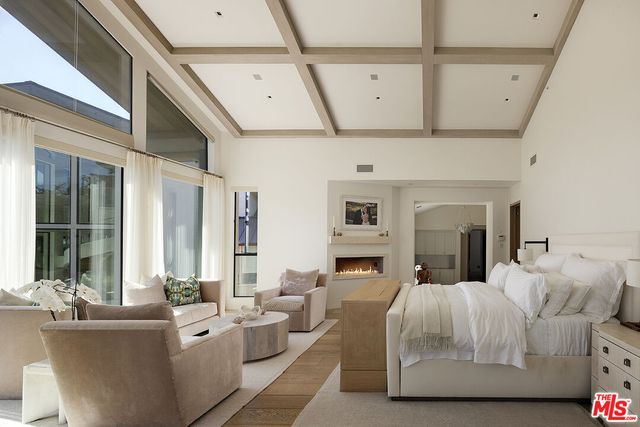 a living room with furniture and a book shelf
