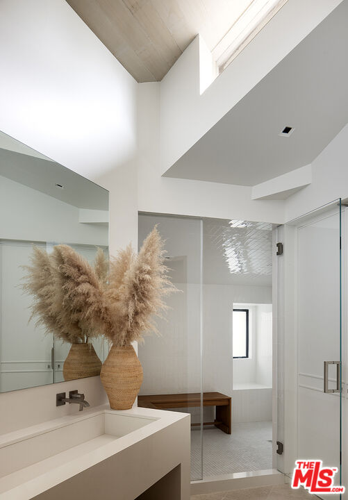 4145 Creciente Drive Santa Barbara, CA 93110 - Photo 30 of 57 a bathroom with a sink and a mirror