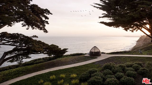 a view of swimming pool with a lounge chair