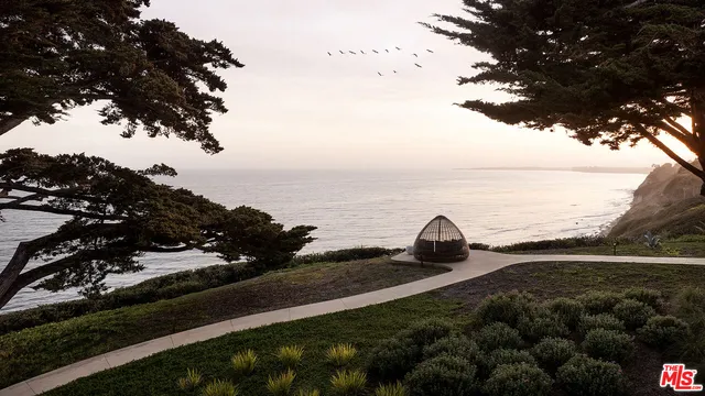 a view of swimming pool with a lounge chair