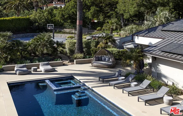 a view of outdoor space with swimming pool and patio