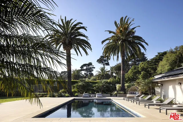 a view of multiple houses with a street