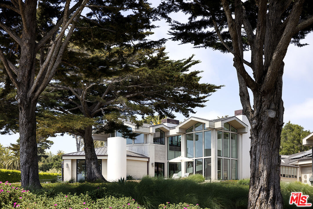 4145 Creciente Drive Santa Barbara, CA 93110 - Photo 42 of 57 a front view of a house with a garden