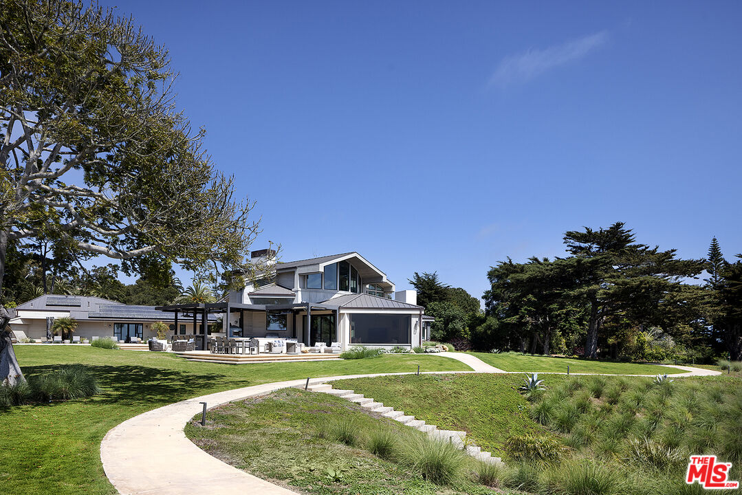 4145 Creciente Drive Santa Barbara, CA 93110 - Photo 44 of 57 a front view of a house with a yard