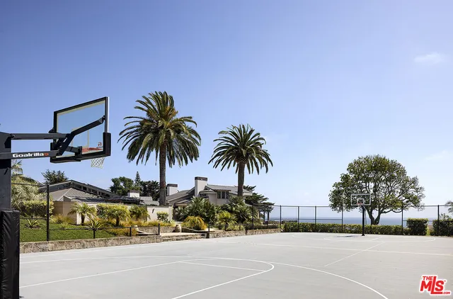 a front view of a house with swimming pool having outdoor seating