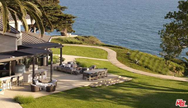 a view of a backyard of the house