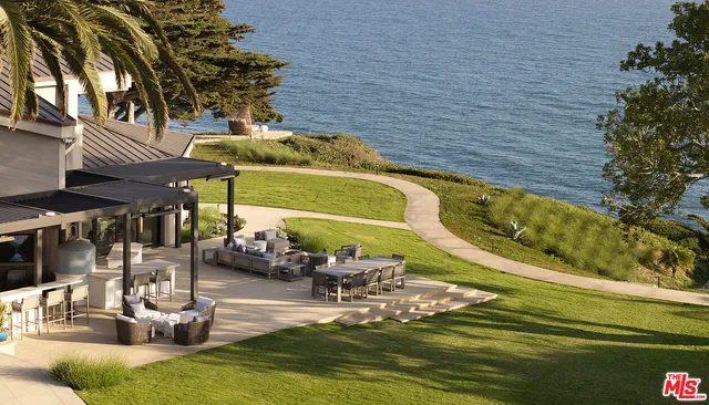 a view of a backyard of the house