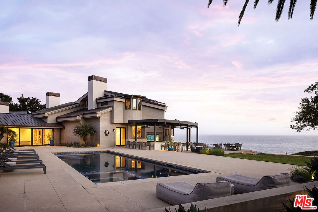 4145 Creciente Drive Santa Barbara, CA 93110 - Photo 50 of 57 a front view of a house with swimming pool having outdoor seating