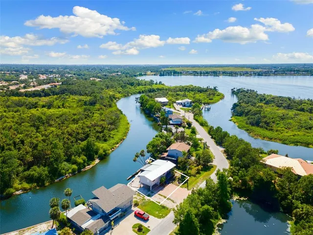 an aerial view of lake residential house with outdoor space