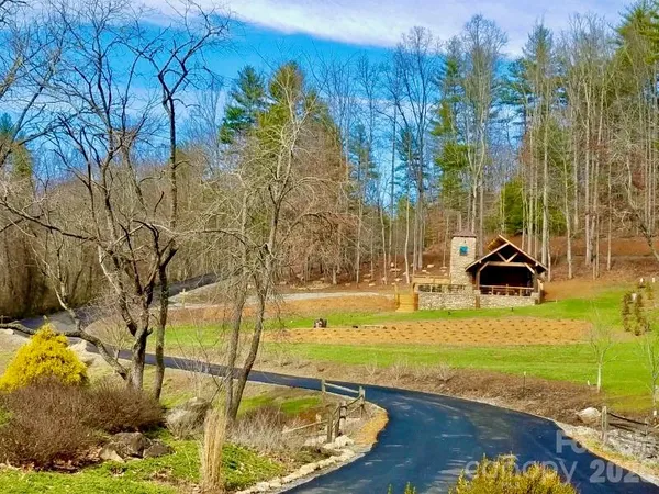 a swimming pool with some trees in the background