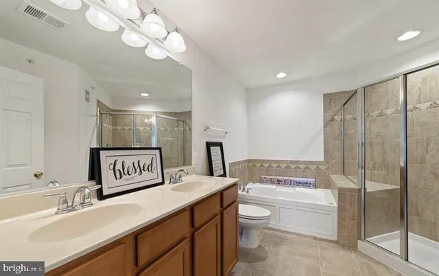 a bathroom with a bathtub and shower