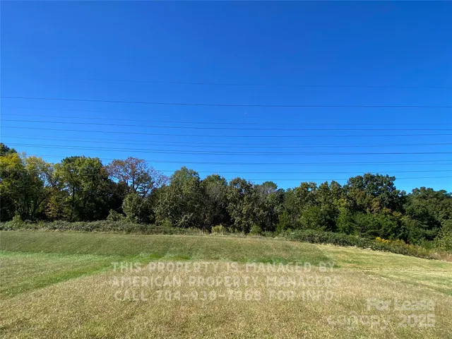 a view of a field with an ocean