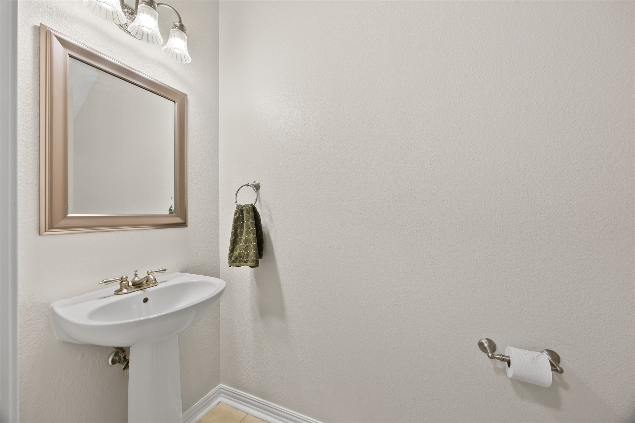 2219 Louetta Brook Lane Spring, TX 77388 - Photo 22 of 34 Convenient powder bath with pedestal sink located on the first floor.