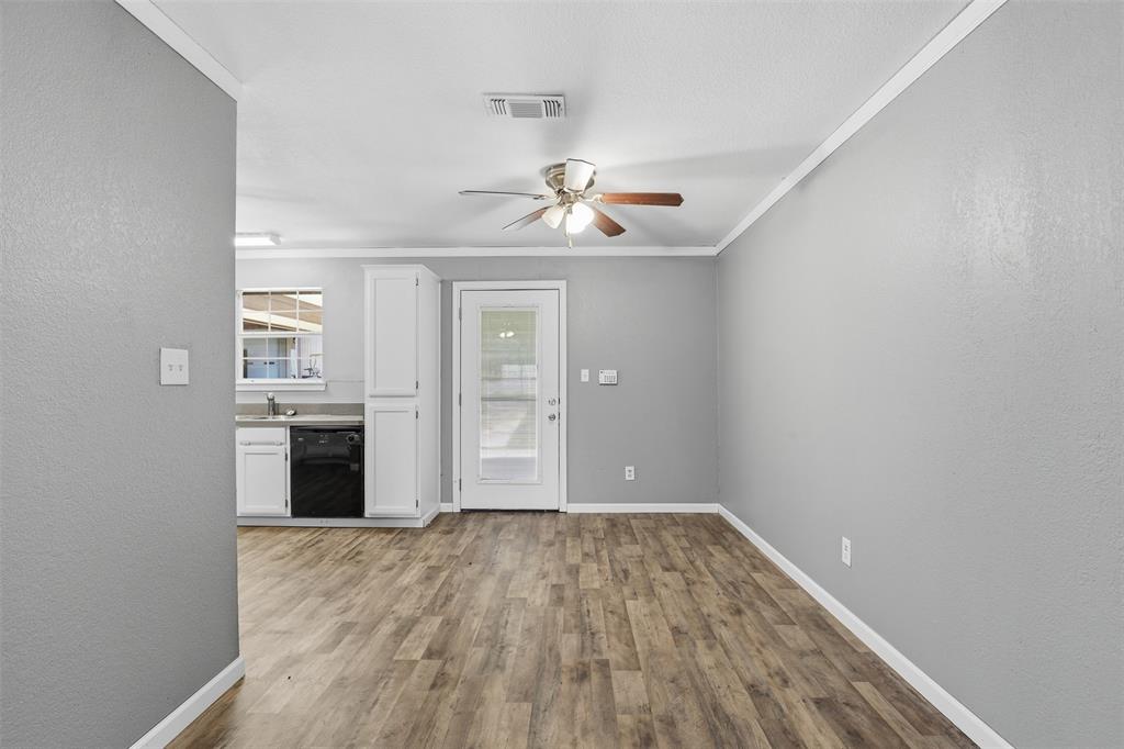 533 Eagles Way Springtown, TX 76082 - Photo 19 of 32 wooden floor in an empty room with a window