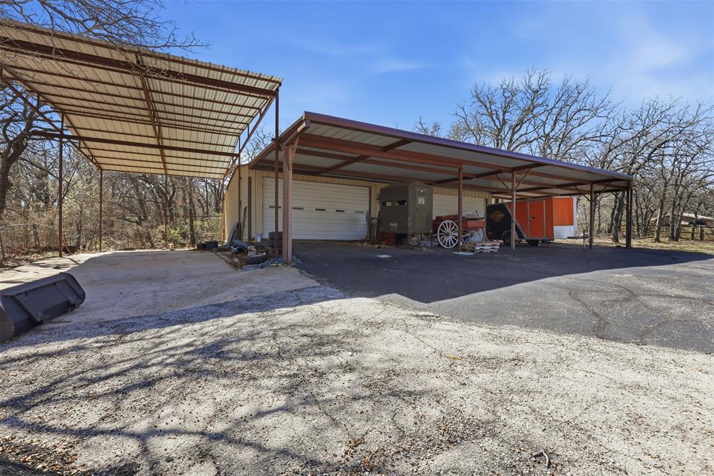533 Eagles Way Springtown, TX 76082 - Photo 26 of 32 a view of a house with a patio
