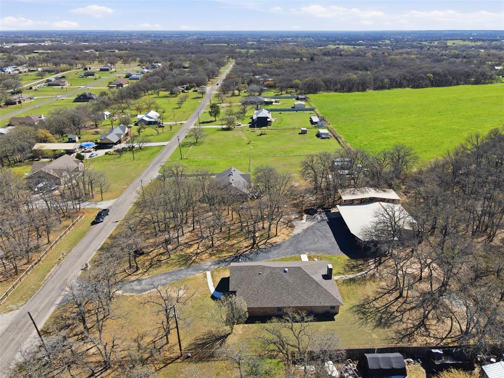 533 Eagles Way Springtown, TX 76082 - Photo 30 of 32 an aerial view of a house with a garden
