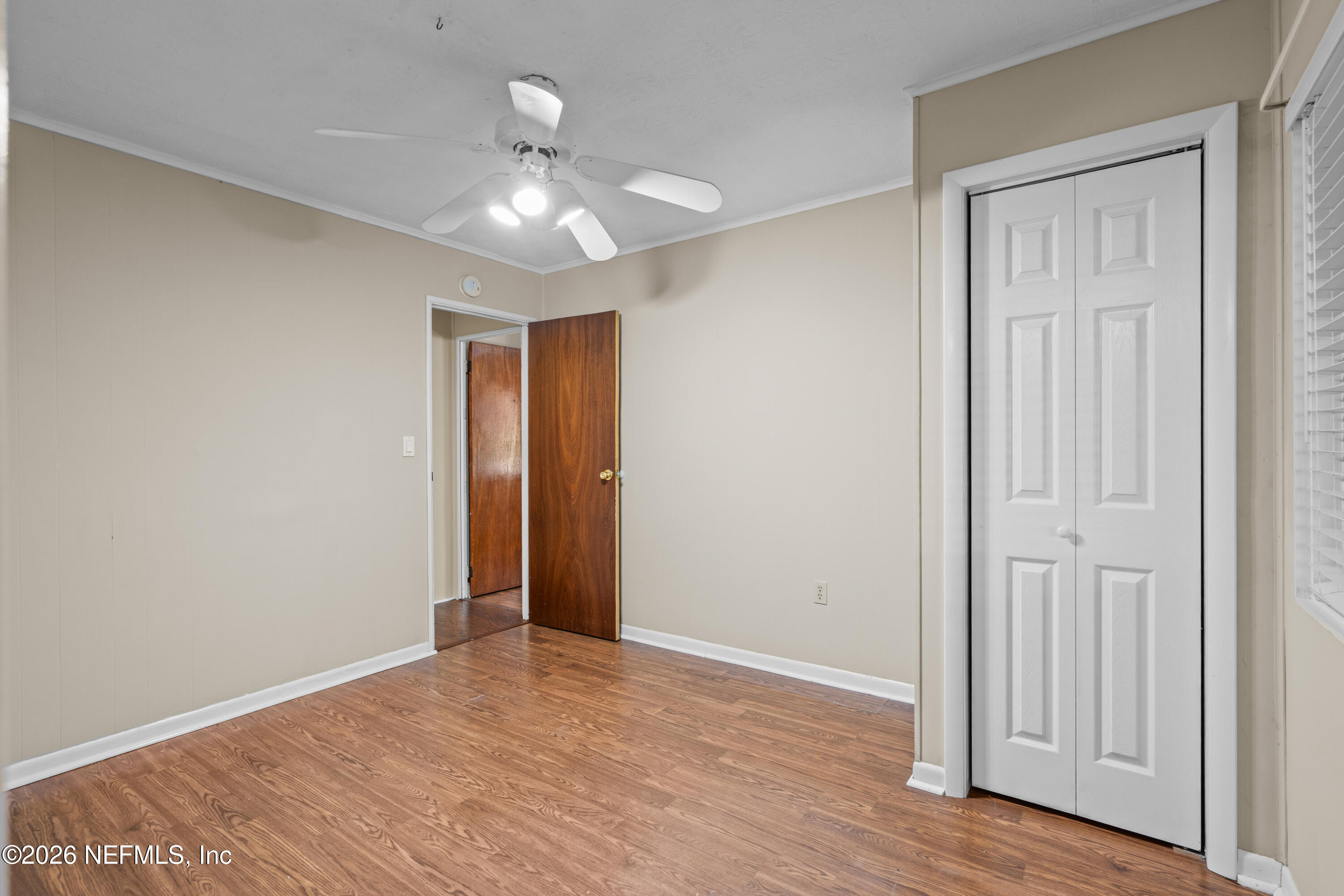 253 Cowry Road St. Augustine, FL 32086 - Photo 18 of 27 a view of an empty room with wooden floor