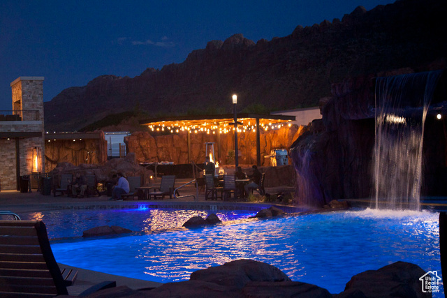 2331 Mesa Road, Unit E3 Moab, UT 84532 - Photo 43 of 71 Pool at twilight featuring a patio area