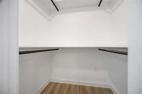 a close view of closet with wooden floor