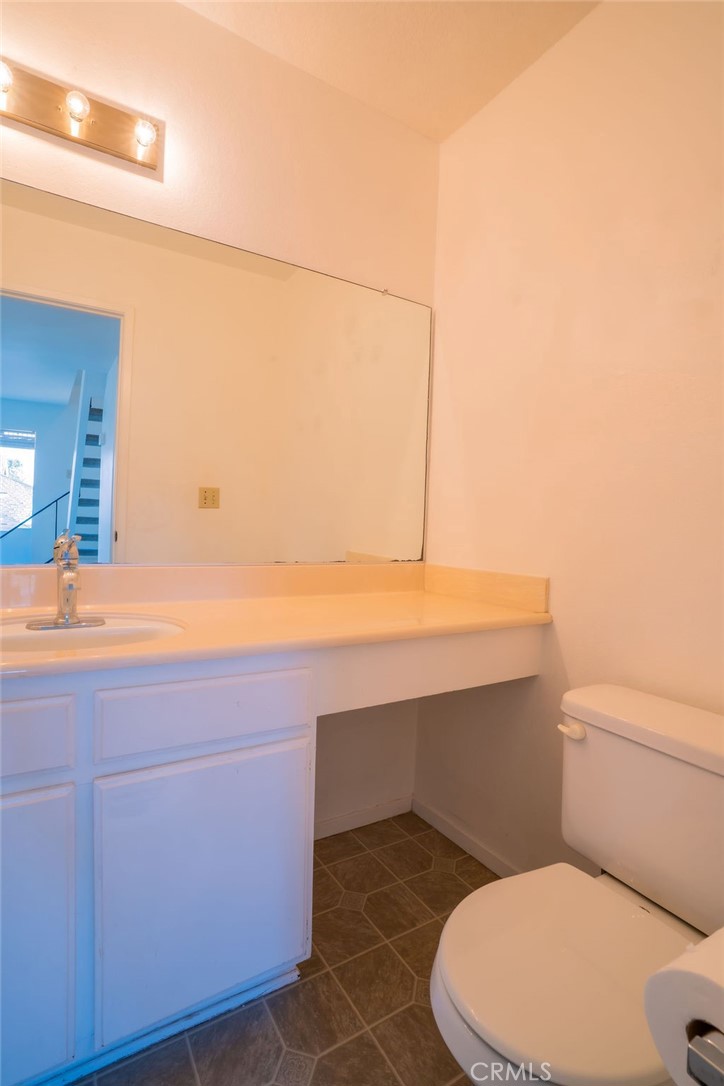 1153 Sumner Place, Unit D Santa Maria, CA 93455 - Photo 15 of 33 a bathroom with a sink a toilet and mirror