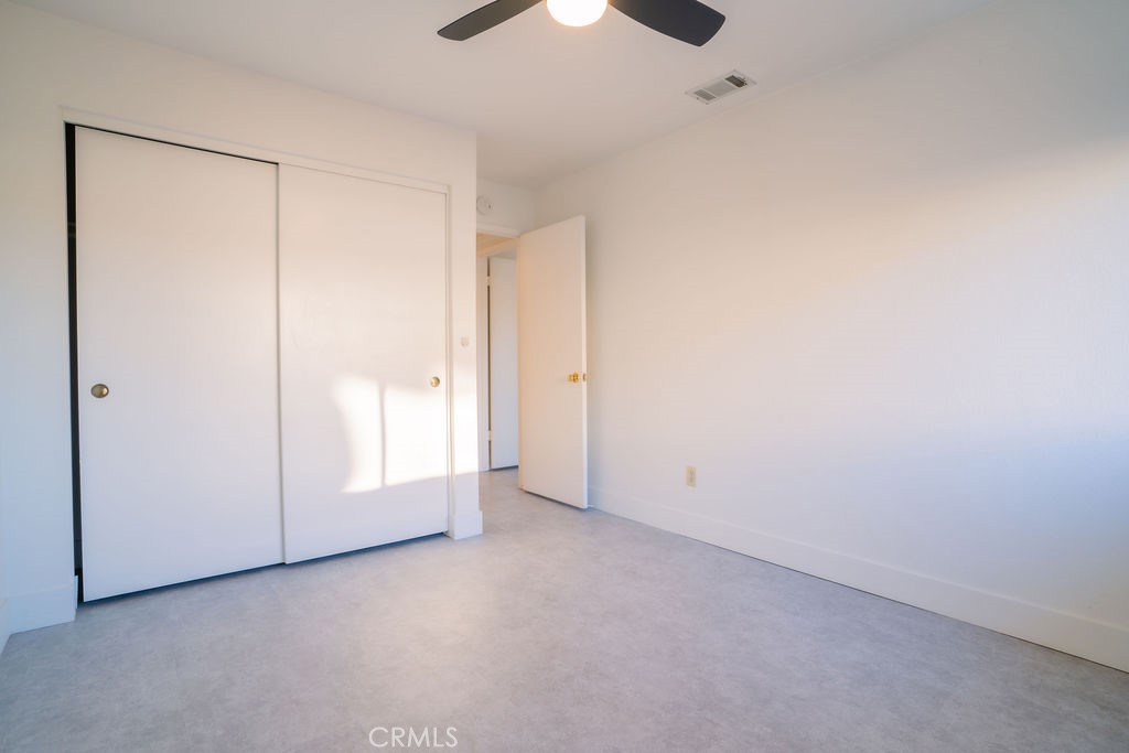 1153 Sumner Place, Unit D Santa Maria, CA 93455 - Photo 17 of 33 an empty room with a empty space and a ceiling fan