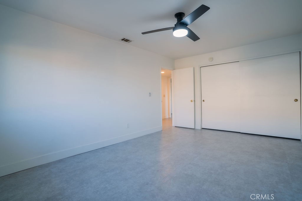 1153 Sumner Place, Unit D Santa Maria, CA 93455 - Photo 18 of 33 an empty room with ceiling fan and window