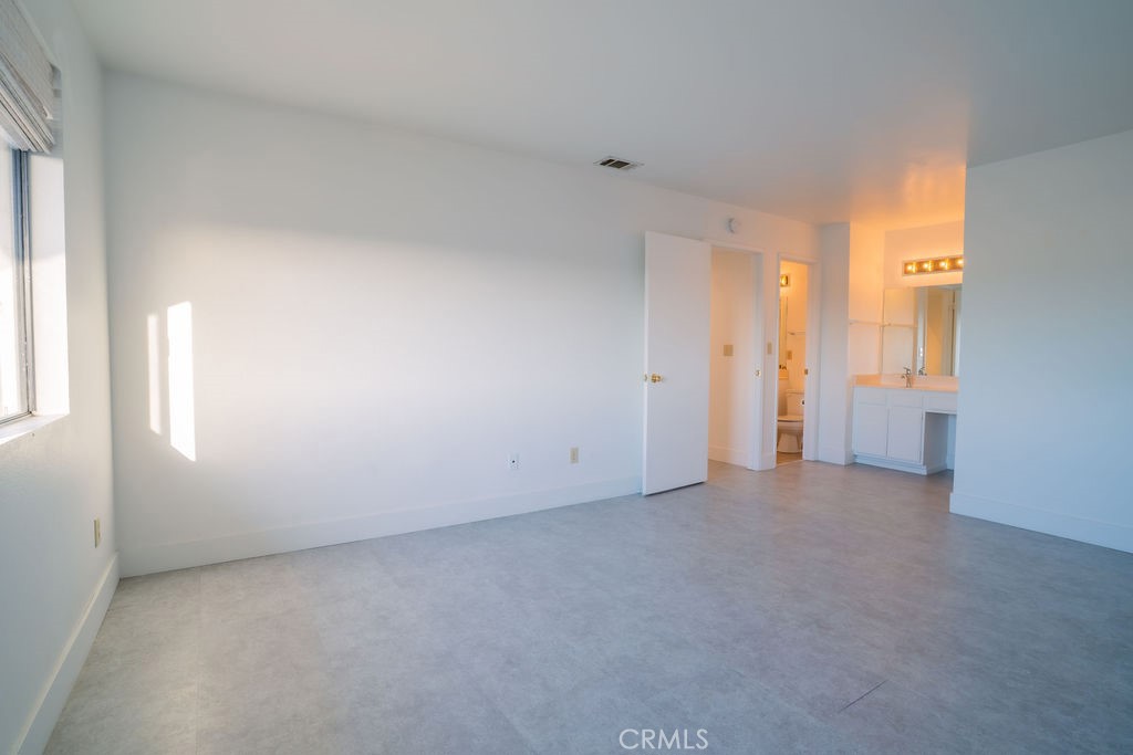1153 Sumner Place, Unit D Santa Maria, CA 93455 - Photo 21 of 33 an empty room with windows