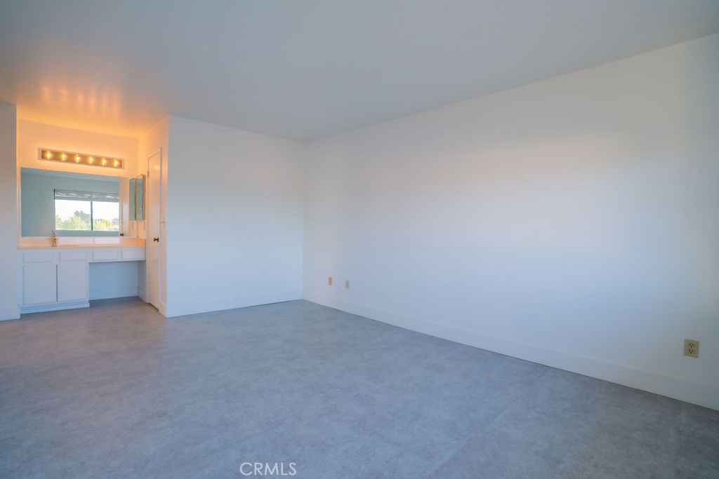 1153 Sumner Place, Unit D Santa Maria, CA 93455 - Photo 23 of 33 an empty room with windows