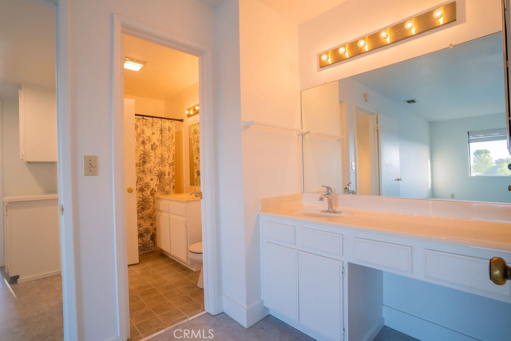 1153 Sumner Place, Unit D Santa Maria, CA 93455 - Photo 26 of 33 a bathroom with a sink and a mirror