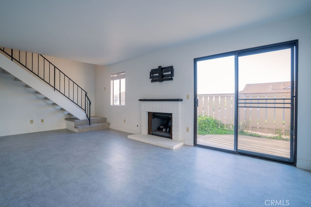 1153 Sumner Place, Unit D Santa Maria, CA 93455 - Photo 7 of 33 a view of a livingroom with an empty space and a fireplace