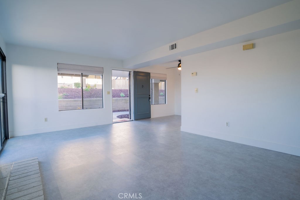 1153 Sumner Place, Unit D Santa Maria, CA 93455 - Photo 10 of 33 a view of an empty room with a window and wooden floor
