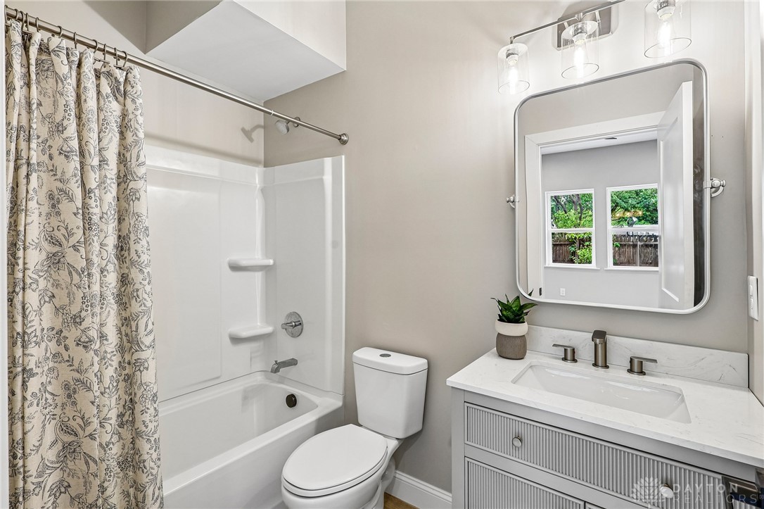 3906 Edwards Road, Unit C Cincinnati, OH 45209 - Photo 9 of 46 This bathroom features a contemporary vanity with a sleek faucet, offering modern convenience and style.