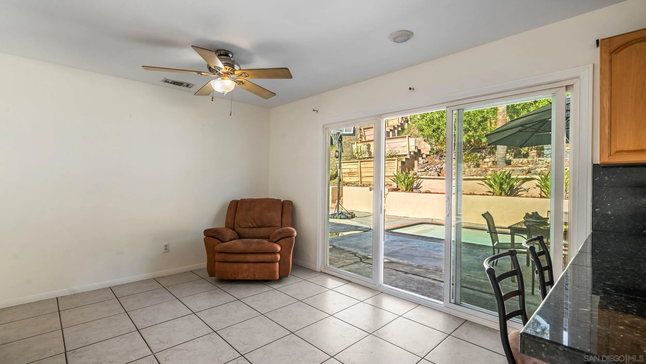 10019 Settle Road Santee, CA 92071 - Photo 17 of 35 a living room with furniture and a floor to ceiling window