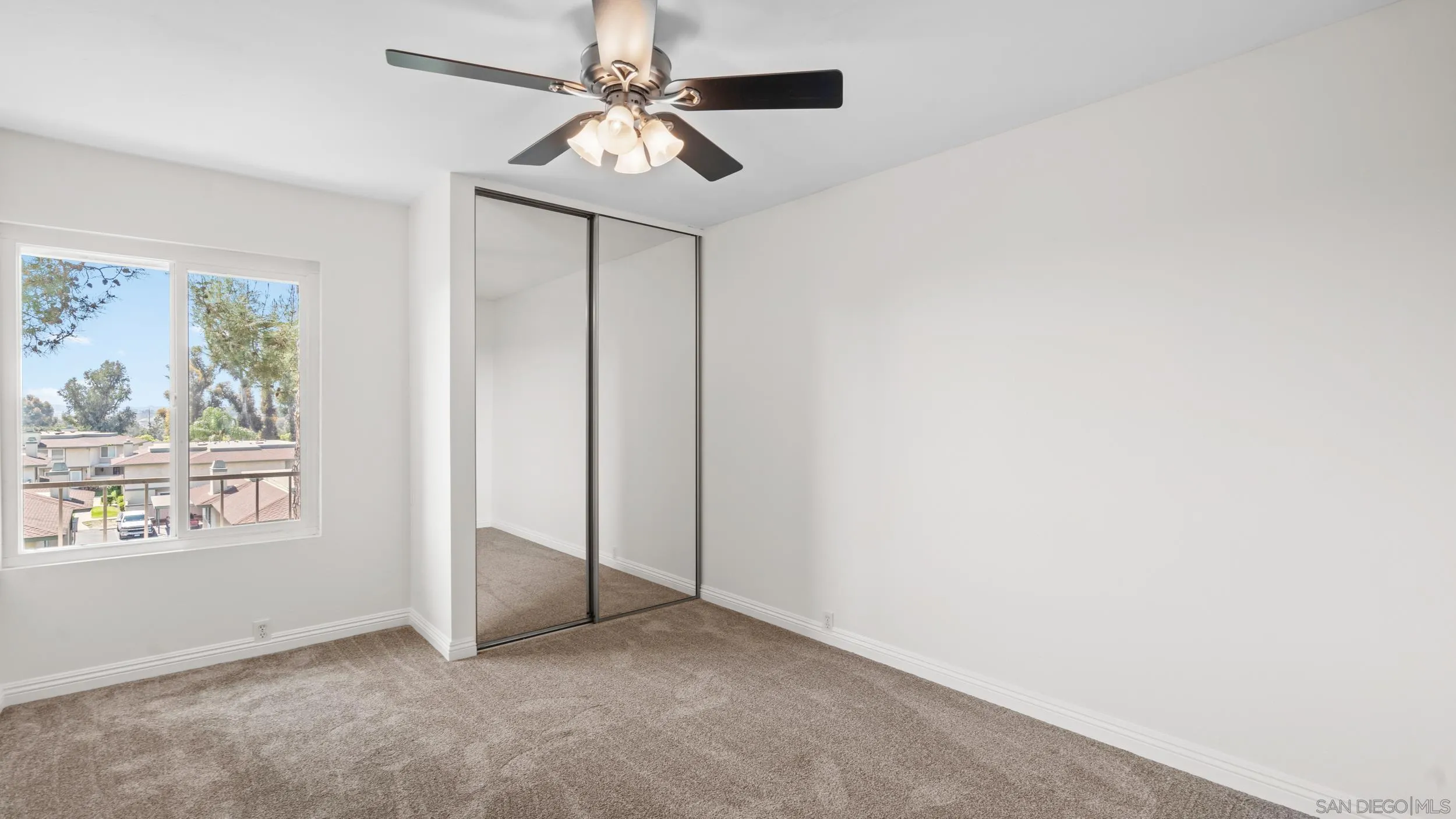 10019 Settle Road Santee, CA 92071 - Photo 18 of 35 an empty room with windows and fan