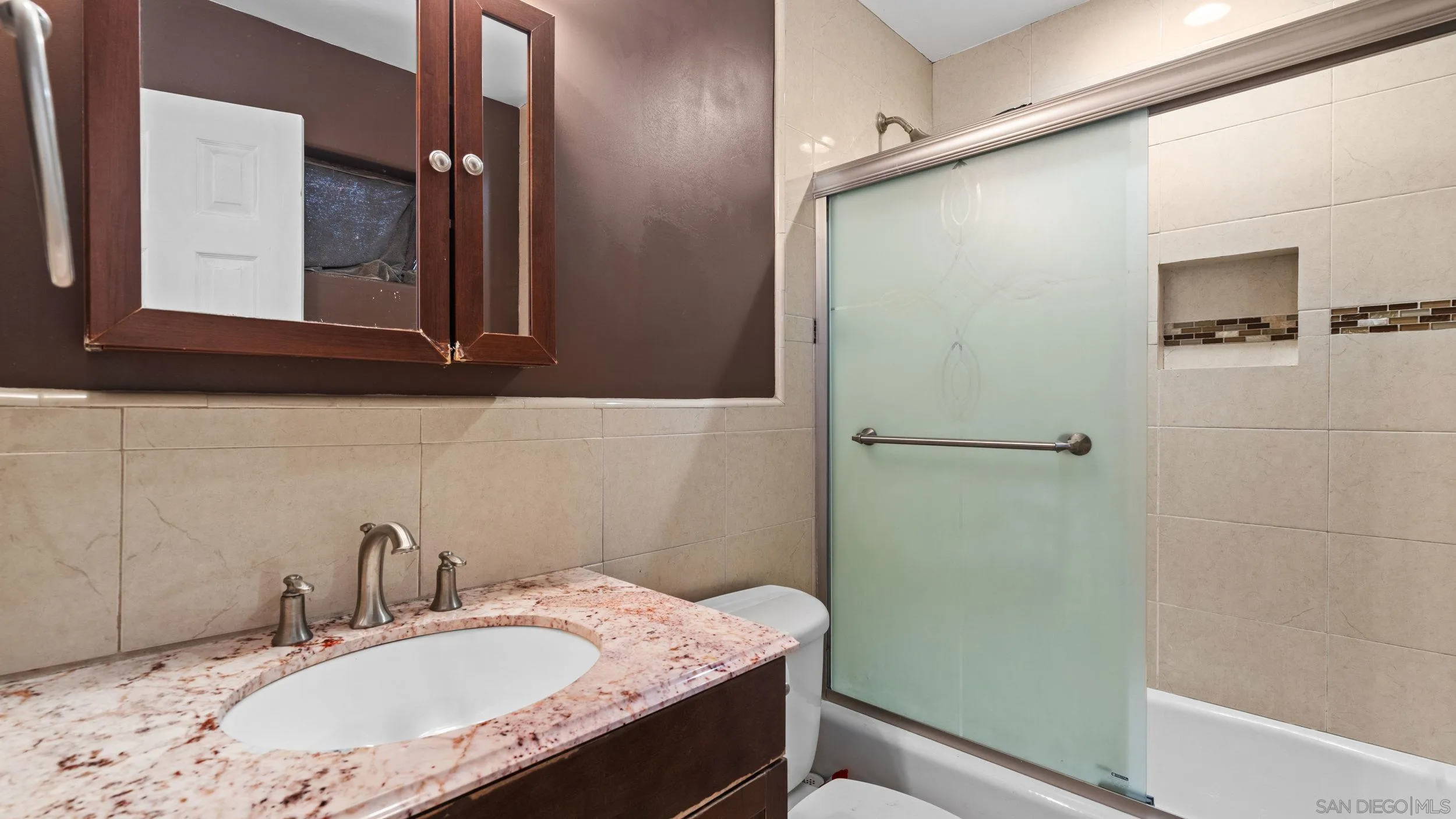 10019 Settle Road Santee, CA 92071 - Photo 22 of 35 a bathroom with a granite countertop sink mirror and a bathtub