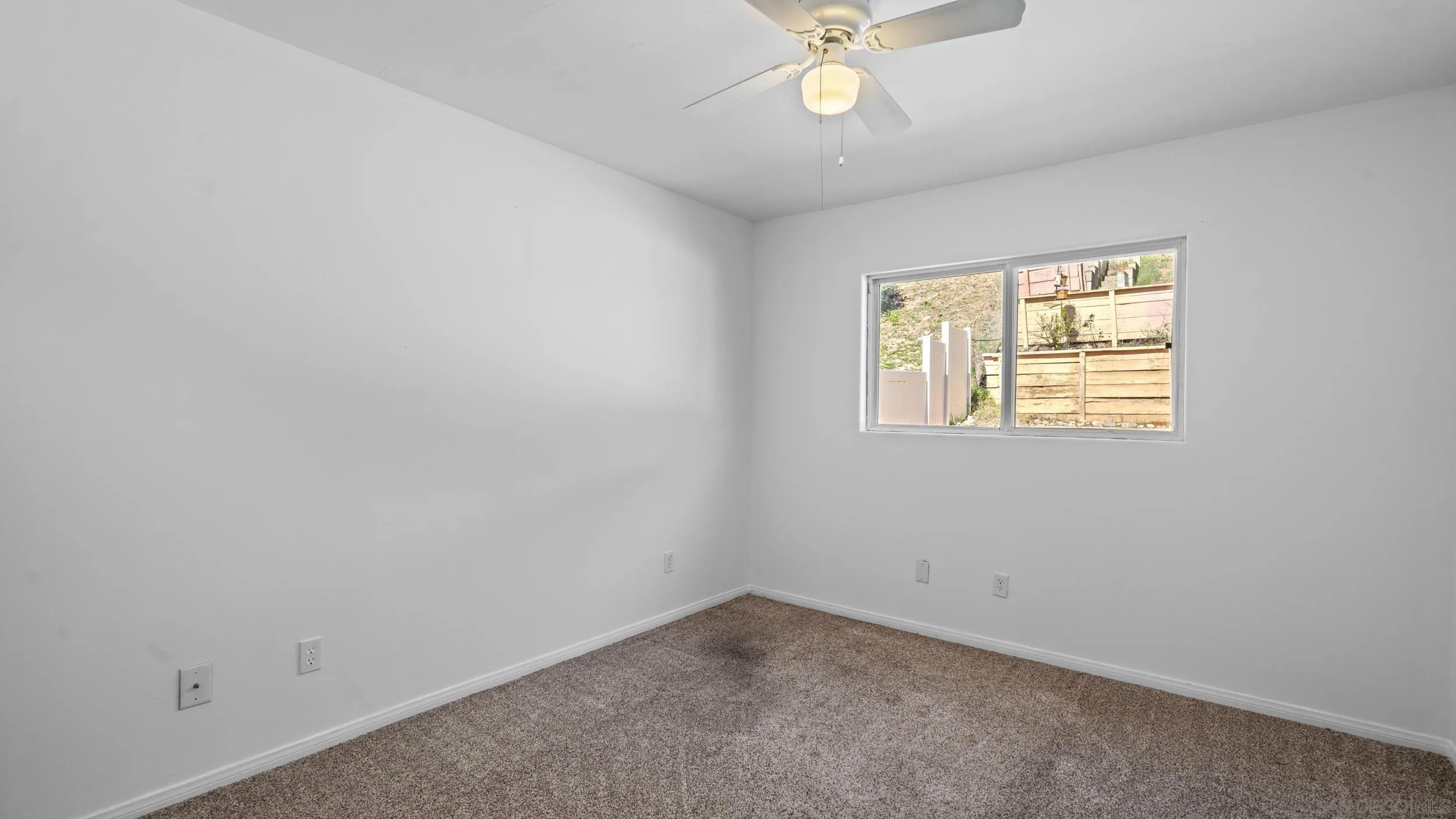 10019 Settle Road Santee, CA 92071 - Photo 24 of 35 an empty room with a window